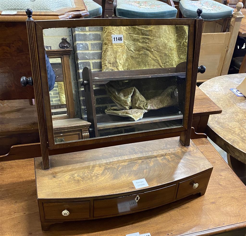 A Regency mahogany bow fronted toilet mirror, width 55cm, depth 21cm, height 57cm